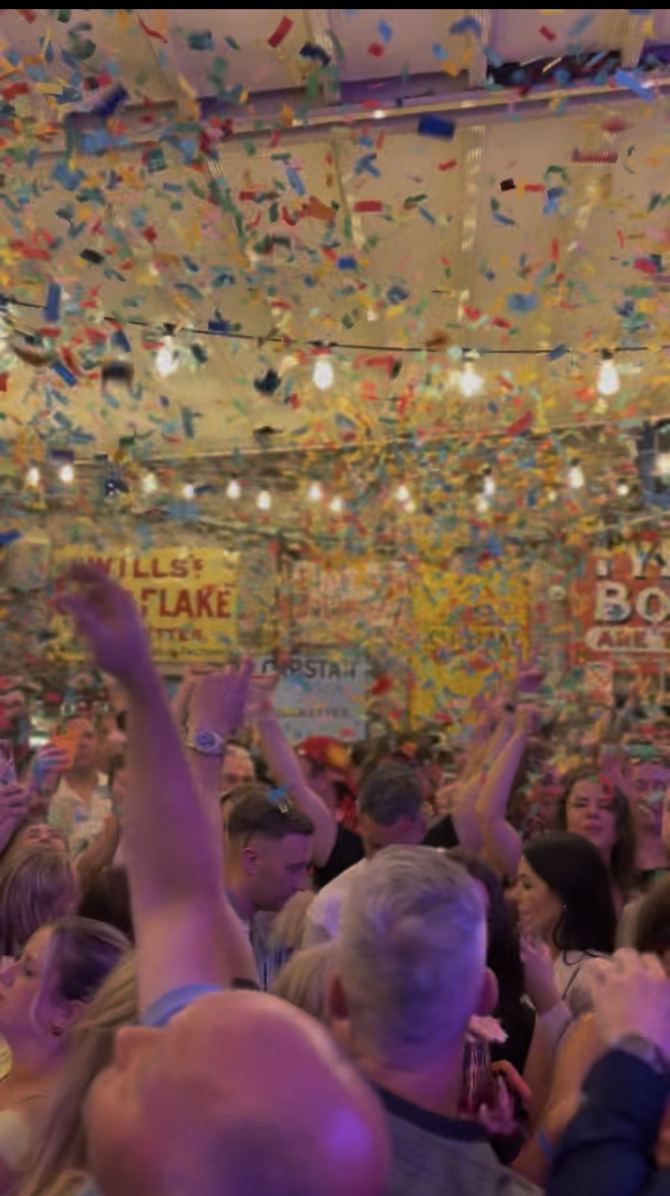 Confetti drop over a packed dance floor