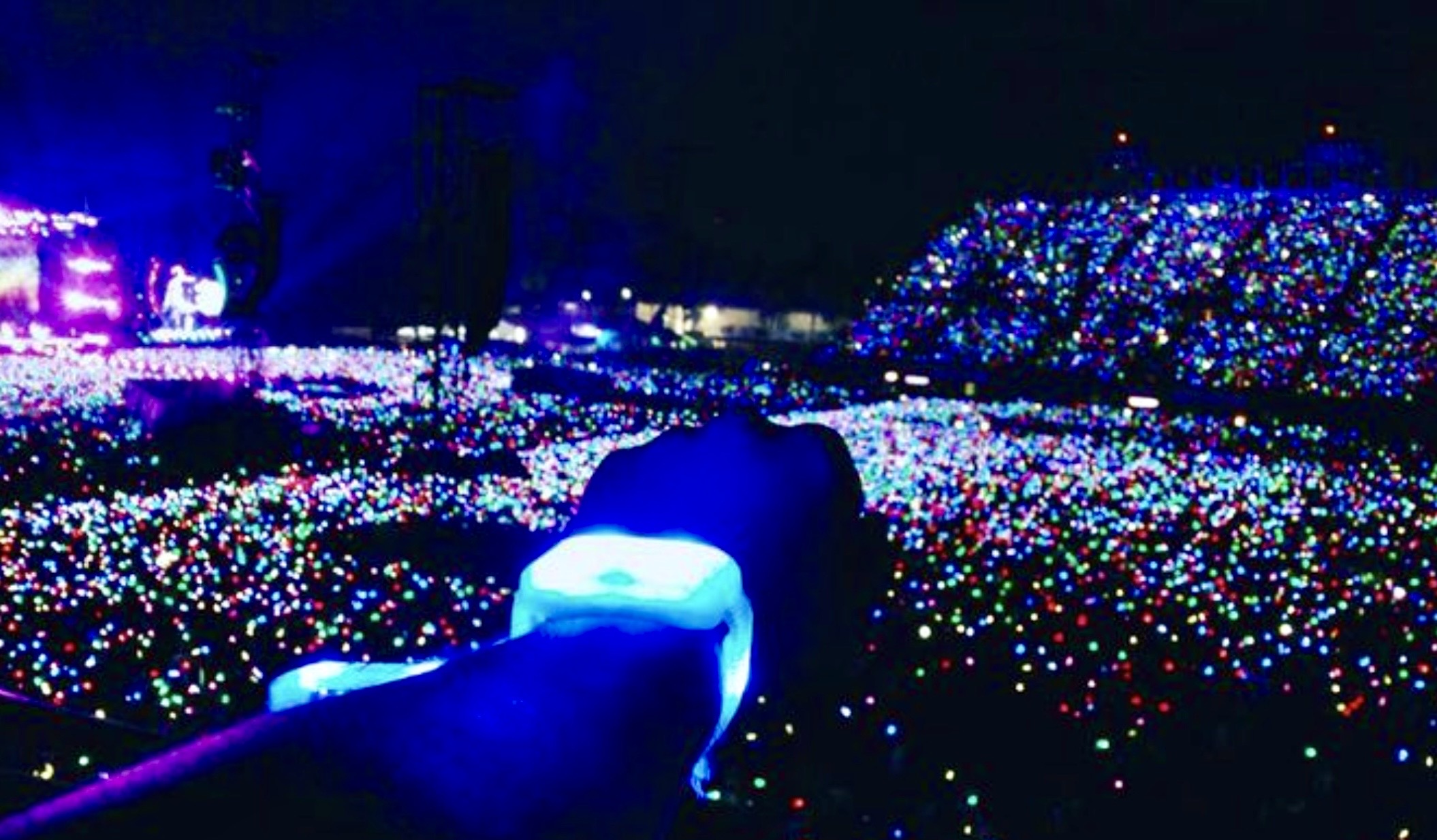 Custom LED wristbands lighting up a crowd